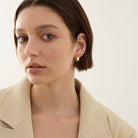 La Muse Huggie Earrings