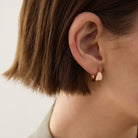 La Muse Huggie Earrings